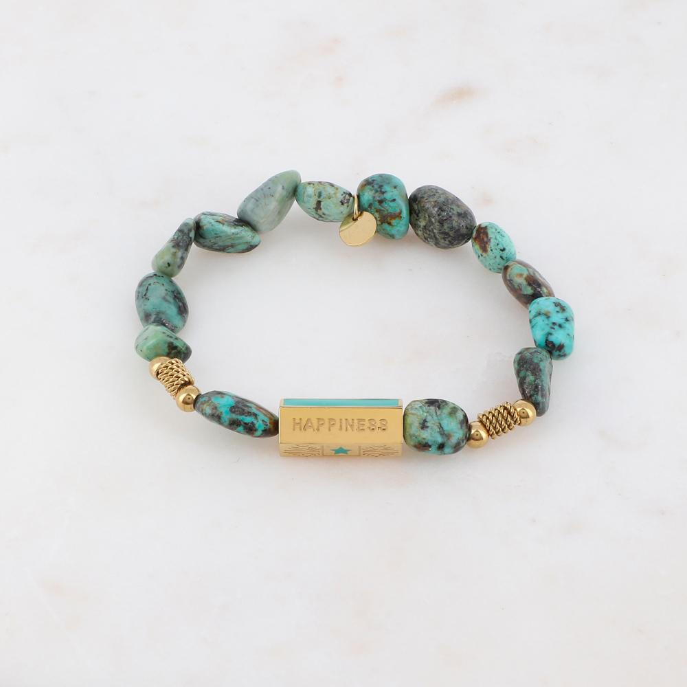Bracelet élastique orné de pierres naturelle turquoise africaine et embelli d'un cylindre de couleur dorée et turquoise | Mathilde & Filles