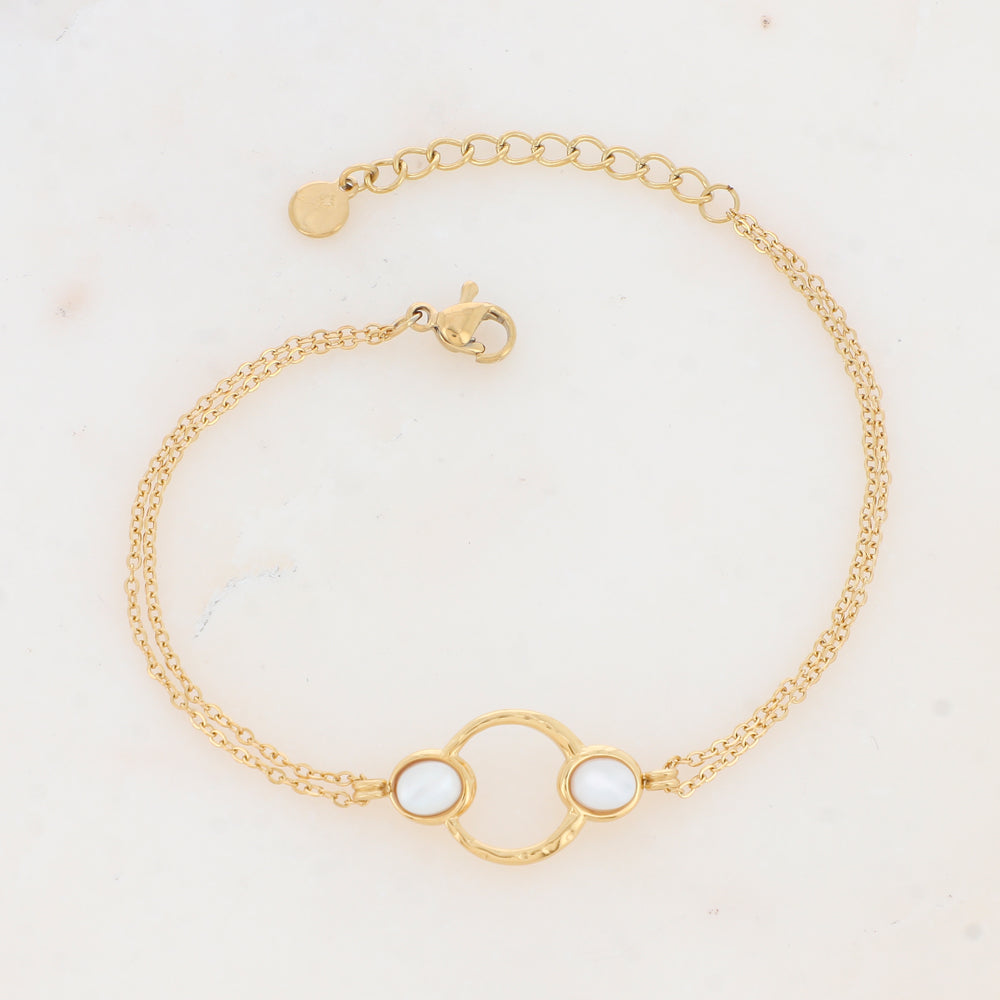 bracelet femme en acier inoxydable embelli d'un cercle ajouré et de deux cabochons en nacre blanche | Mathilde & Filles