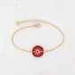 Mathilde & Filles | Bracelet en acier inoxydable pour femme au style intemporel orné d'un cabochon émaillé rouge et d'une étoile scintillante ainsi qu'un strass rouge