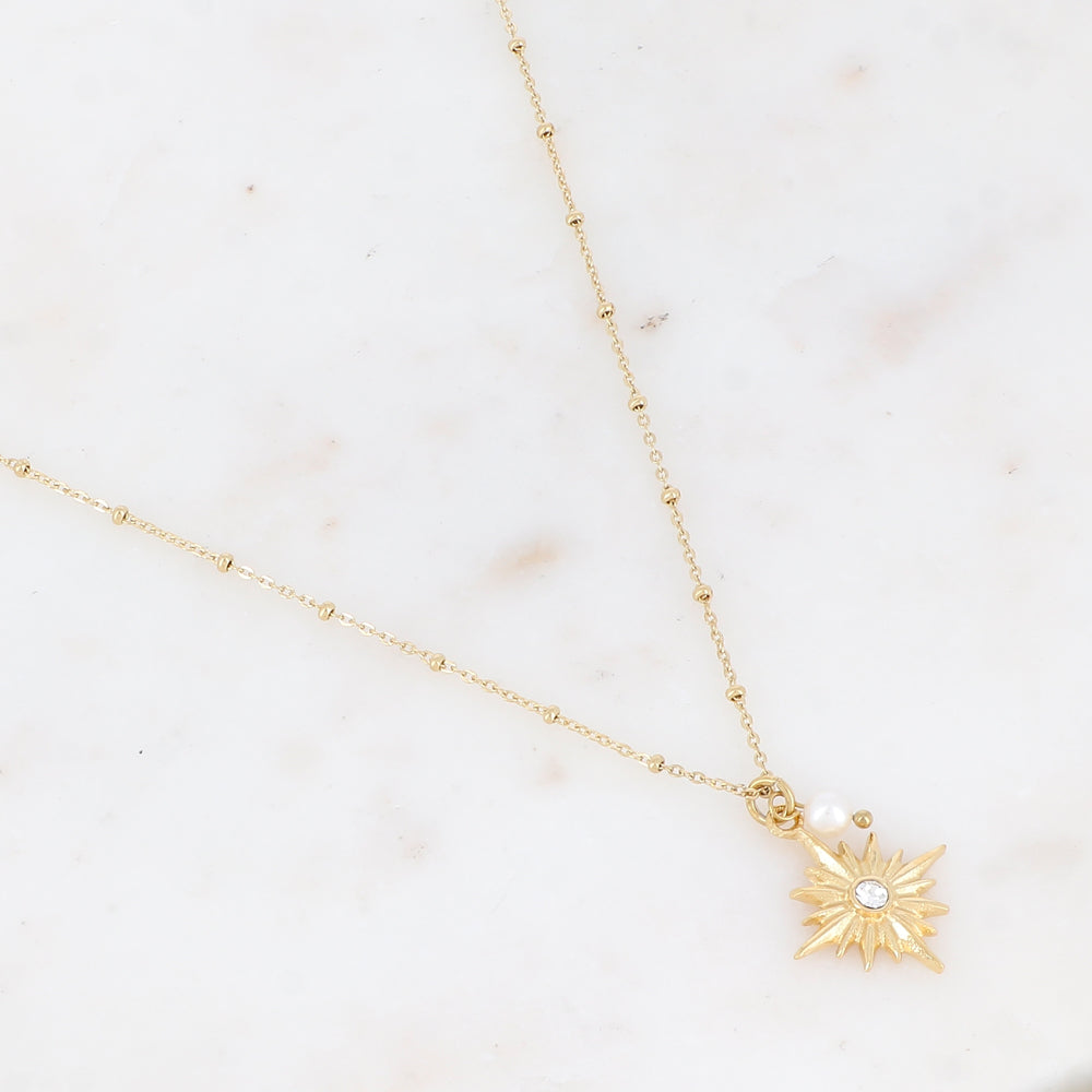 Mathilde & Filles | Collier femme embelli d'une chaine à boules et d'un pendentif étoile joliment sculpté serti d'un zircon et d'une perle d'eau douce