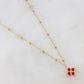 Mathilde & Filles | Collier en acier inoxydable pour femme avec une chaine embellie de boules et un pendentif serti de zircons rouges