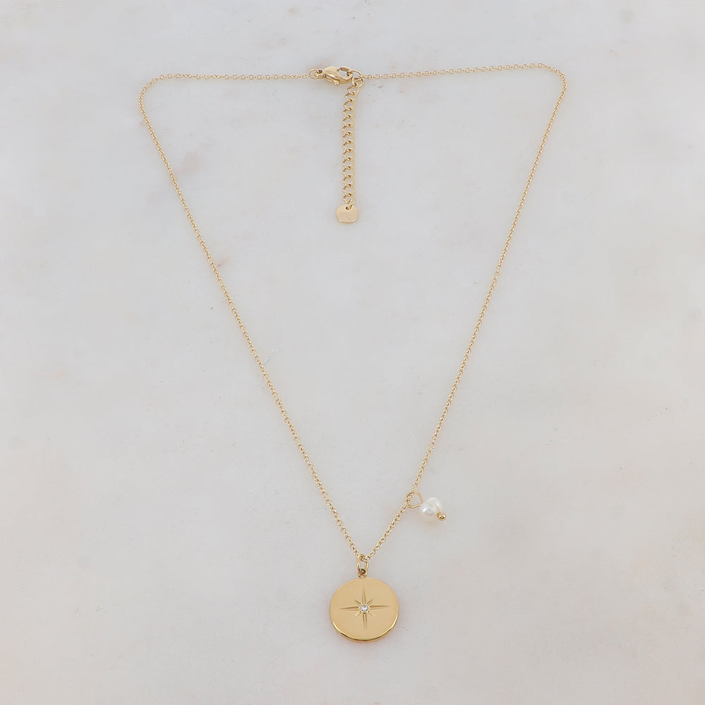 Mathilde & Filles | Collier en acier inoxydable embelli d'un pendentif rond avec une étoile scintillante et une pampille perle de culture